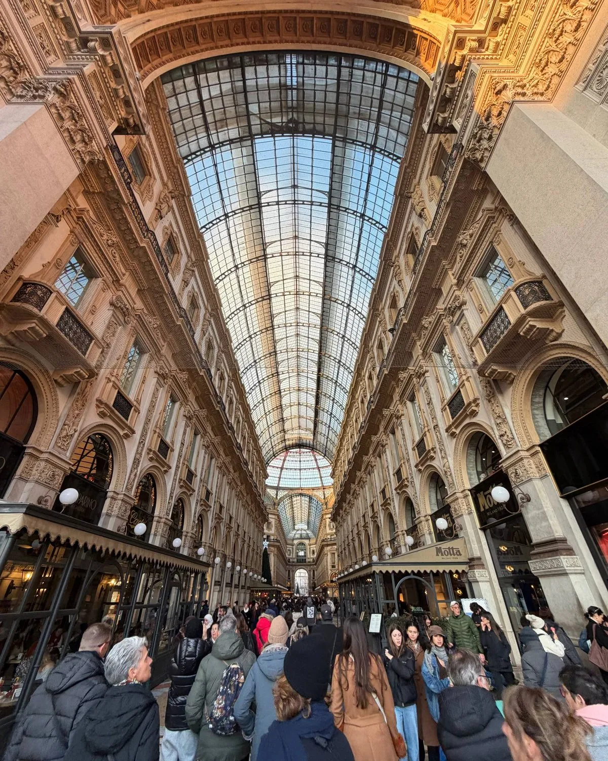 Inside the Galleria Vittorio Emanuele in Milan, the glass-domed arcade.